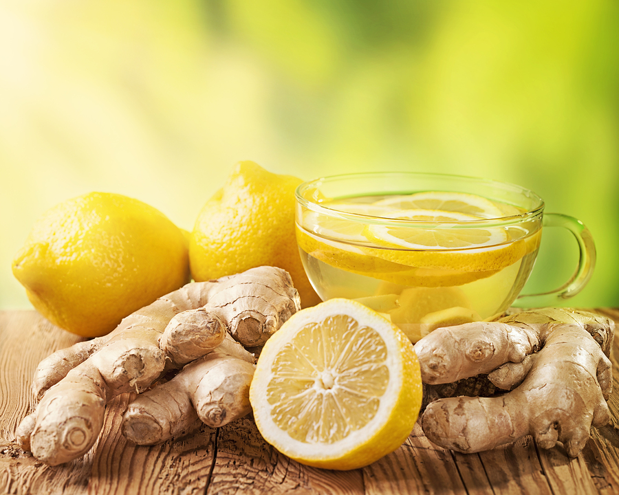 Ginger tea with lemon on a wooden table